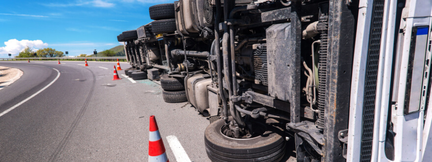 tractor trailer truck lying on its side