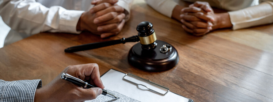 couple in lawyer's office discussing divorce